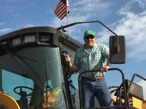 John S. Hundley on a tractor