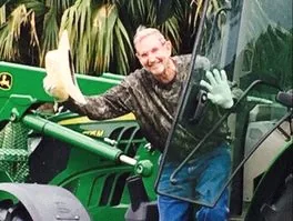 John L. Hundley on a tractor