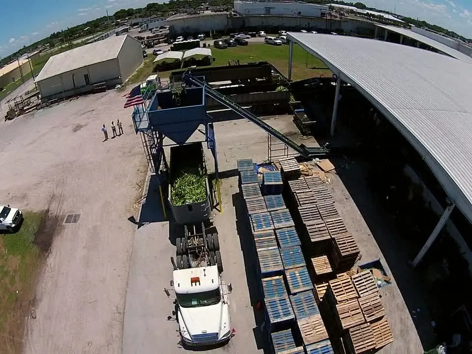 Aerial view of the packing house with corn being loaded